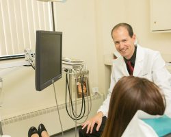 Dr. James Dores with a patient at Dores Dental in East Longmeadow, MA 1